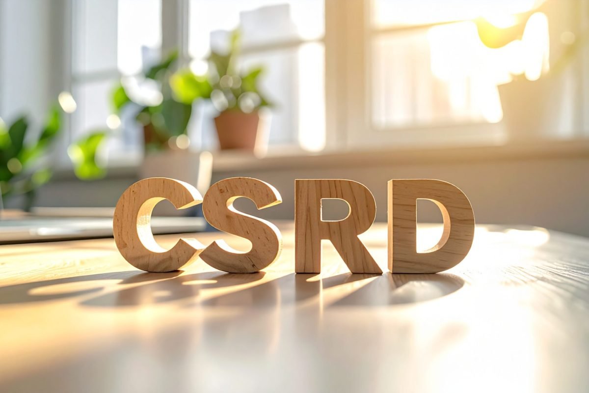 Concept of Corporate Sustainability Reporting Directive CSRD with wooden blocks in bright workspace